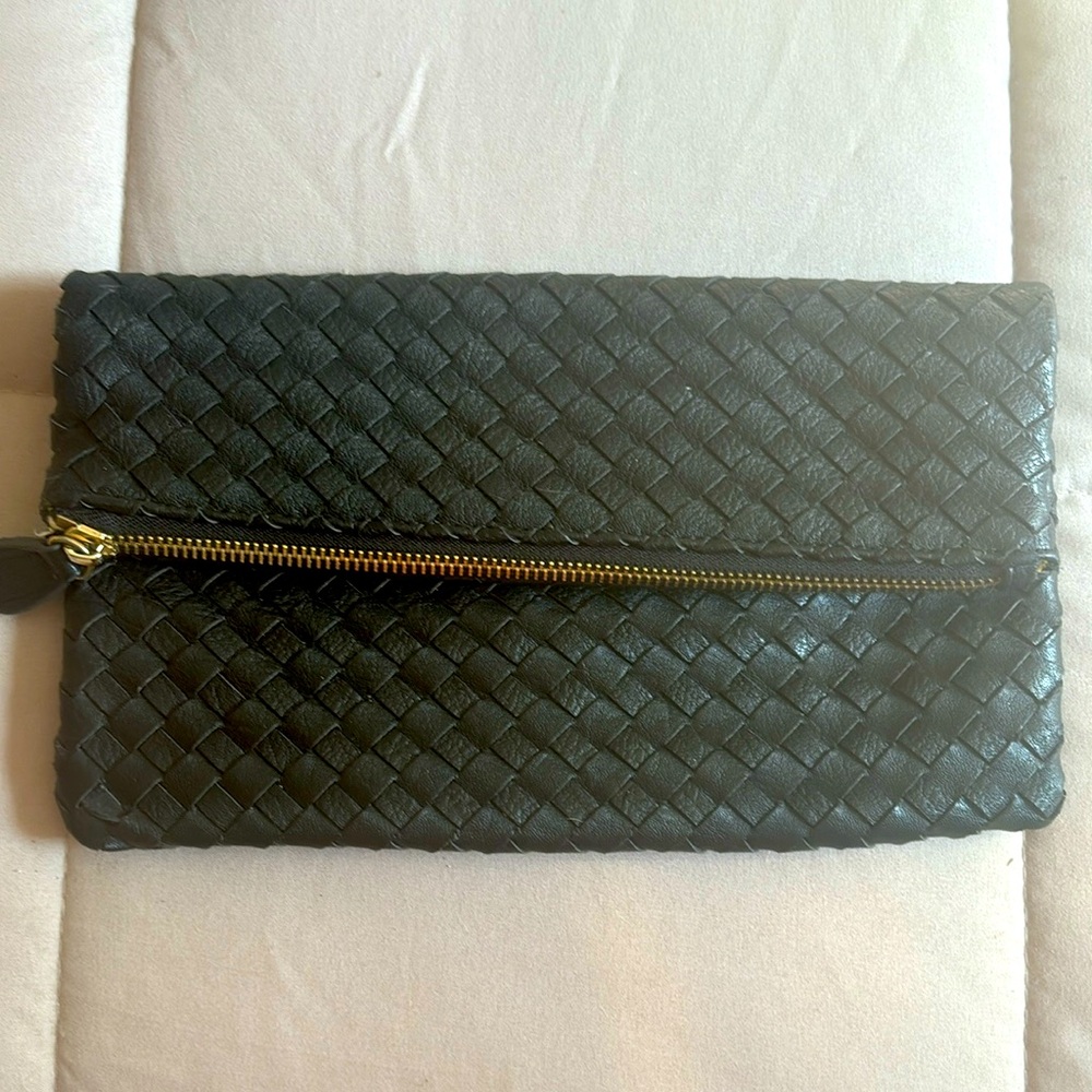 Black leather clutch. Very gently used condition. Clean inside.